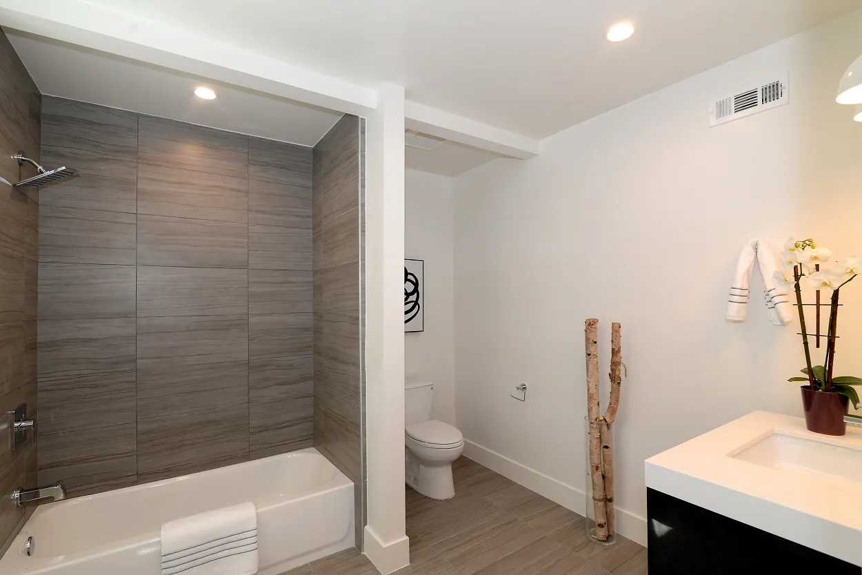 Updated bathroom with modern vanity at the Ivy Project