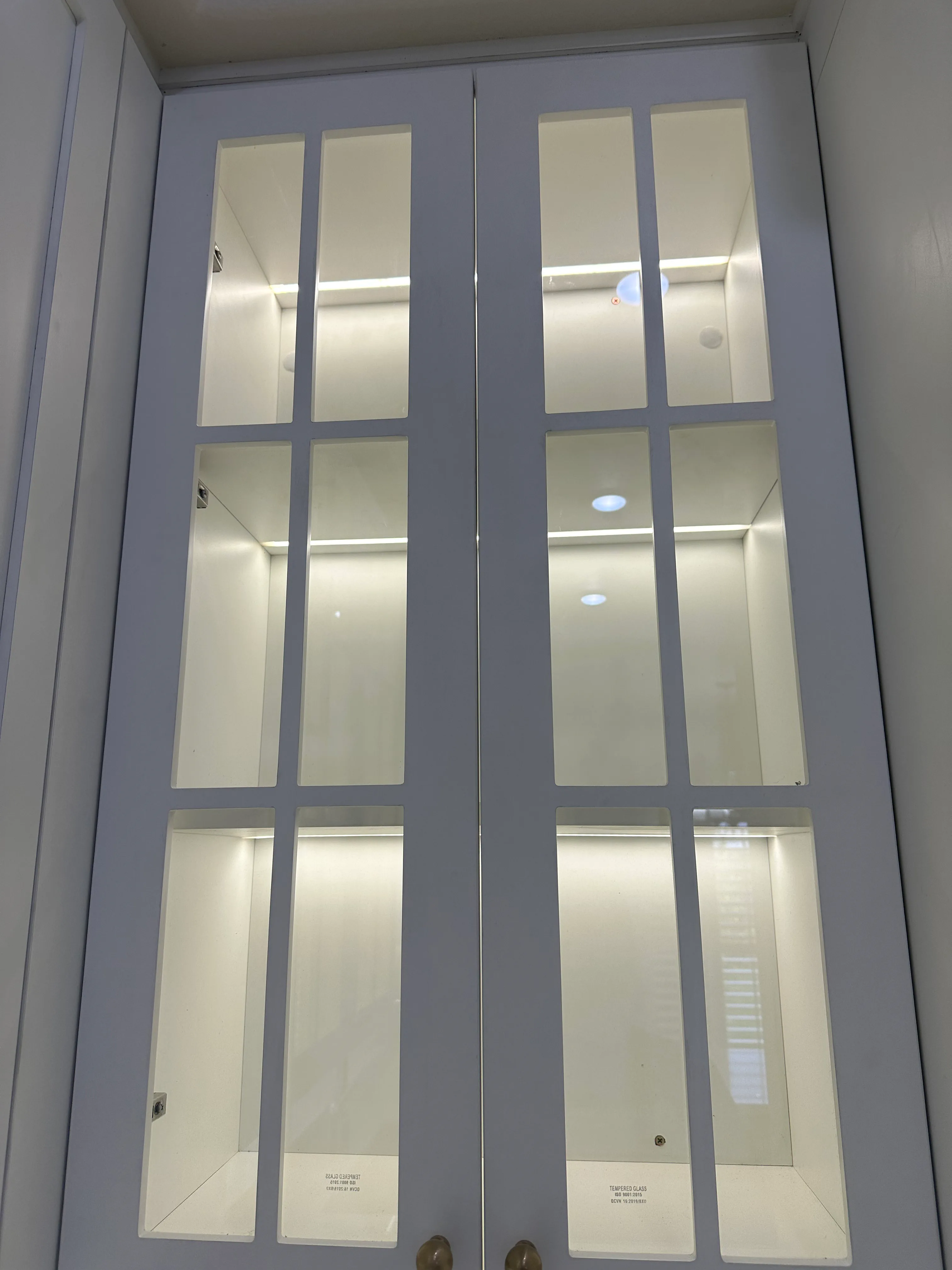 Cabinet hardware and finish detail at Angelica Way